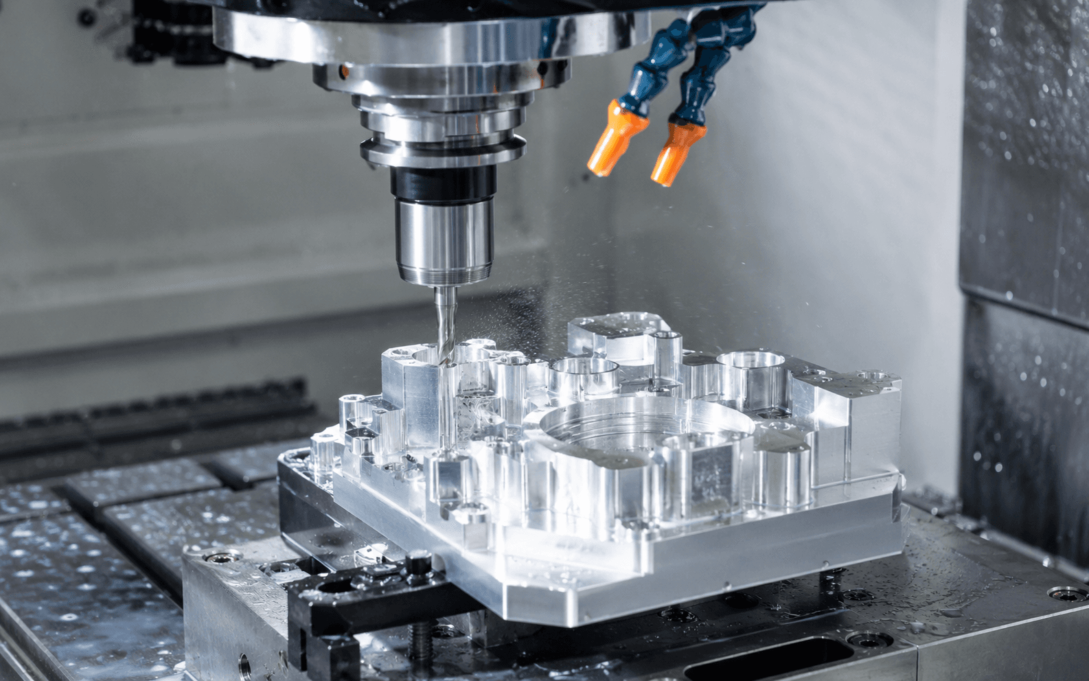 Modern CNC milling machine cutting a precision metal component